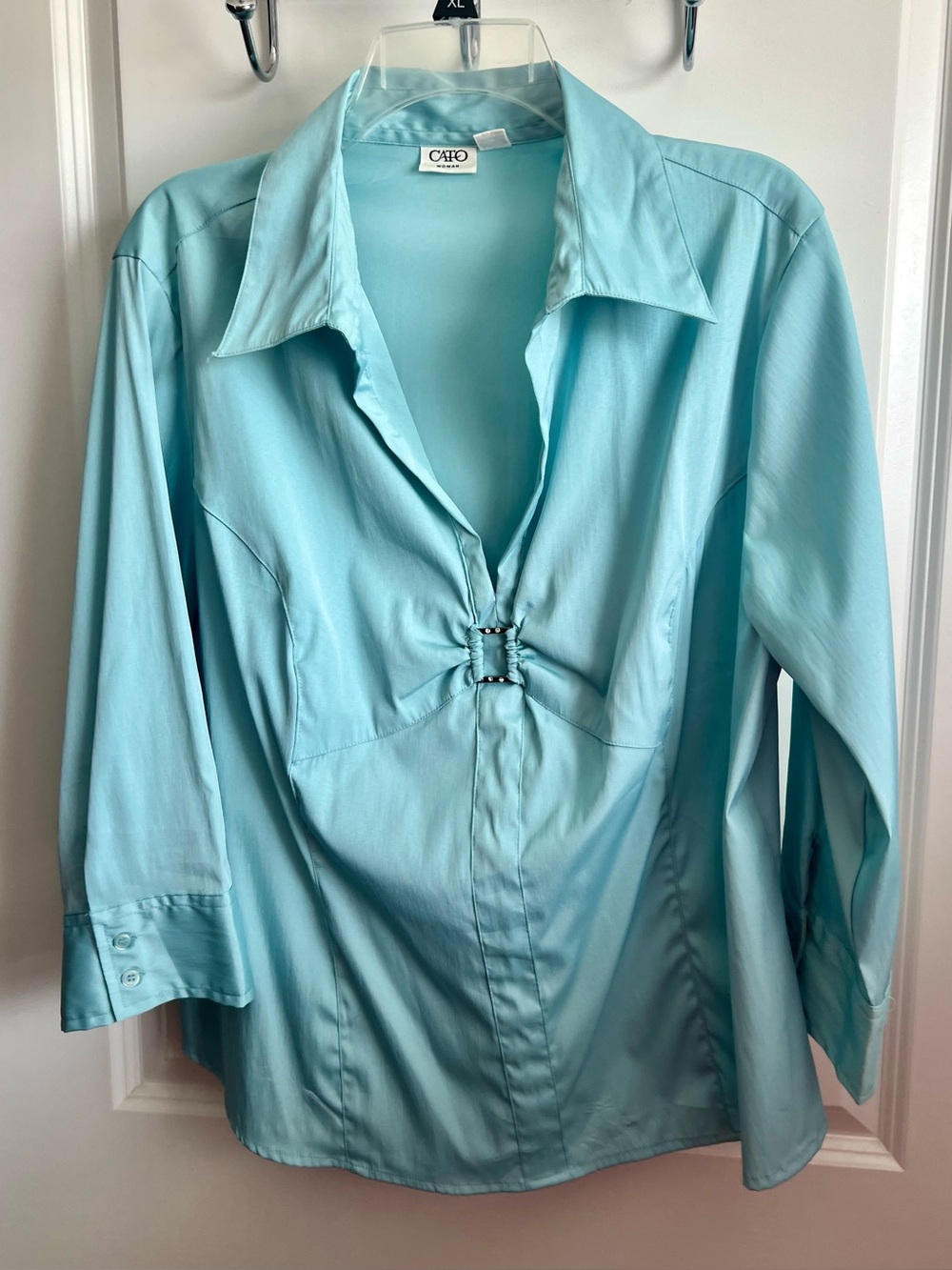 Cato Woman blouse features a distinctive front with rhinestone detail 18-20W